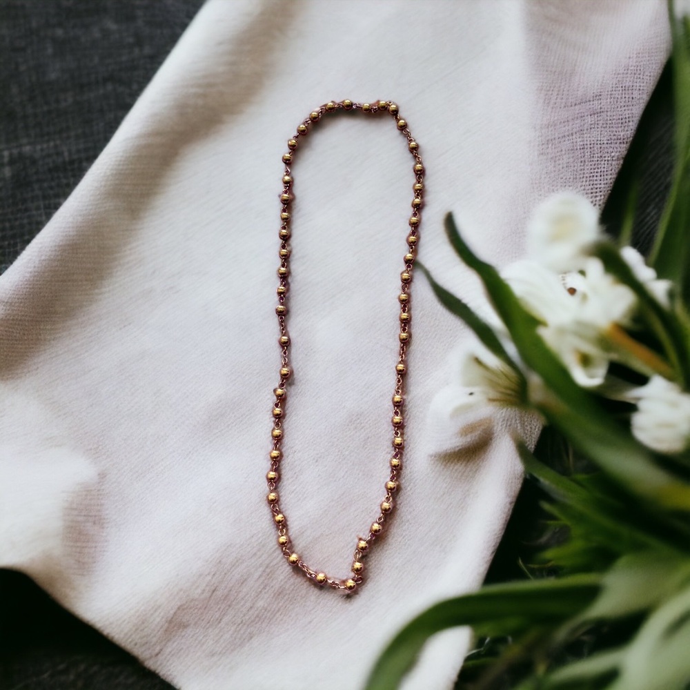 Gold colored necklace beaded